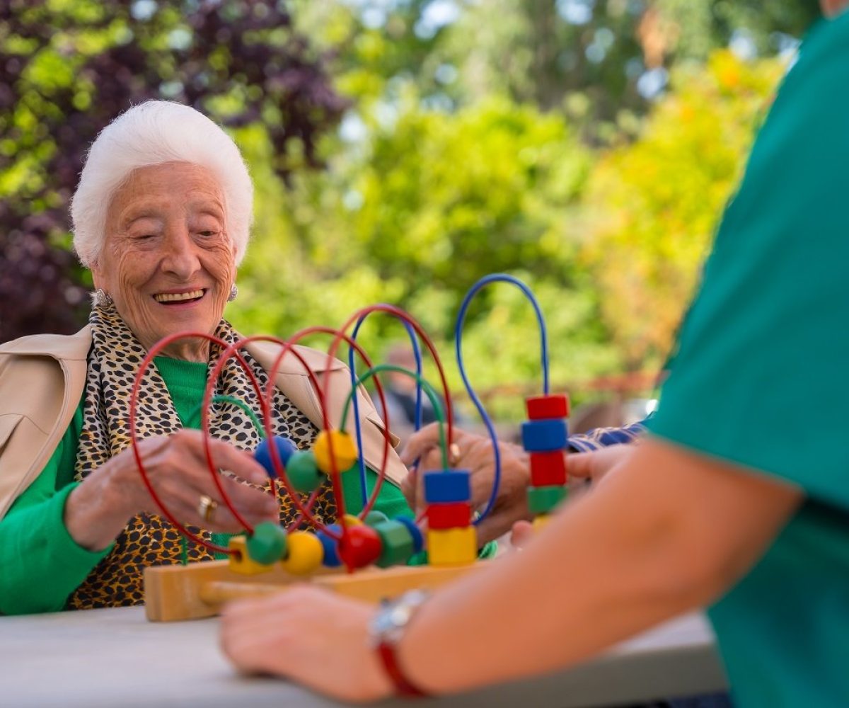 hand-of-an-elderly-woman-in-the-garden-of-a-nursin-2024-12-09-04-55-36-utc.jpg