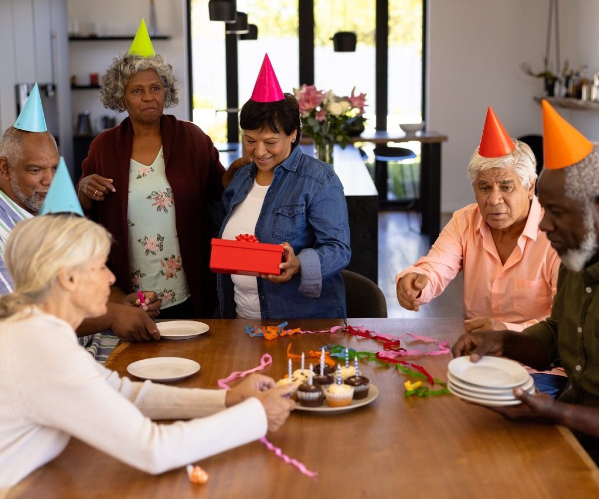 multiracial-senior-friends-wearing-party-hats-doin-2023-11-27-05-18-43-utc.jpg